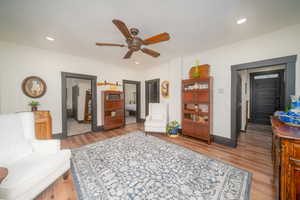 Sitting room featuring ceiling fan, light wood finished floors, and recessed lighting