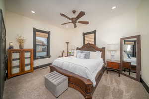 Bedroom featuring carpet, a ceiling fan, and recessed lighting