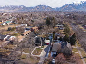Aerial perspective of suburban area featuring a mountainous background