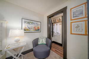 Living area featuring wood finished floors and baseboards