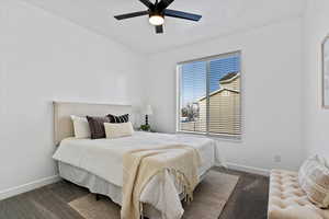 Bedroom with carpet floors and a ceiling fan