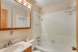Full bath featuring vanity and washtub / shower combination890