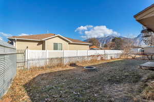 Fenced backyard with a mountain view 890