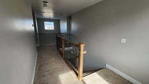 Stairway featuring carpet flooring