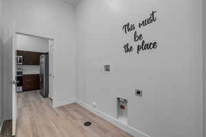 Laundry room with access to garage and community breezeway.