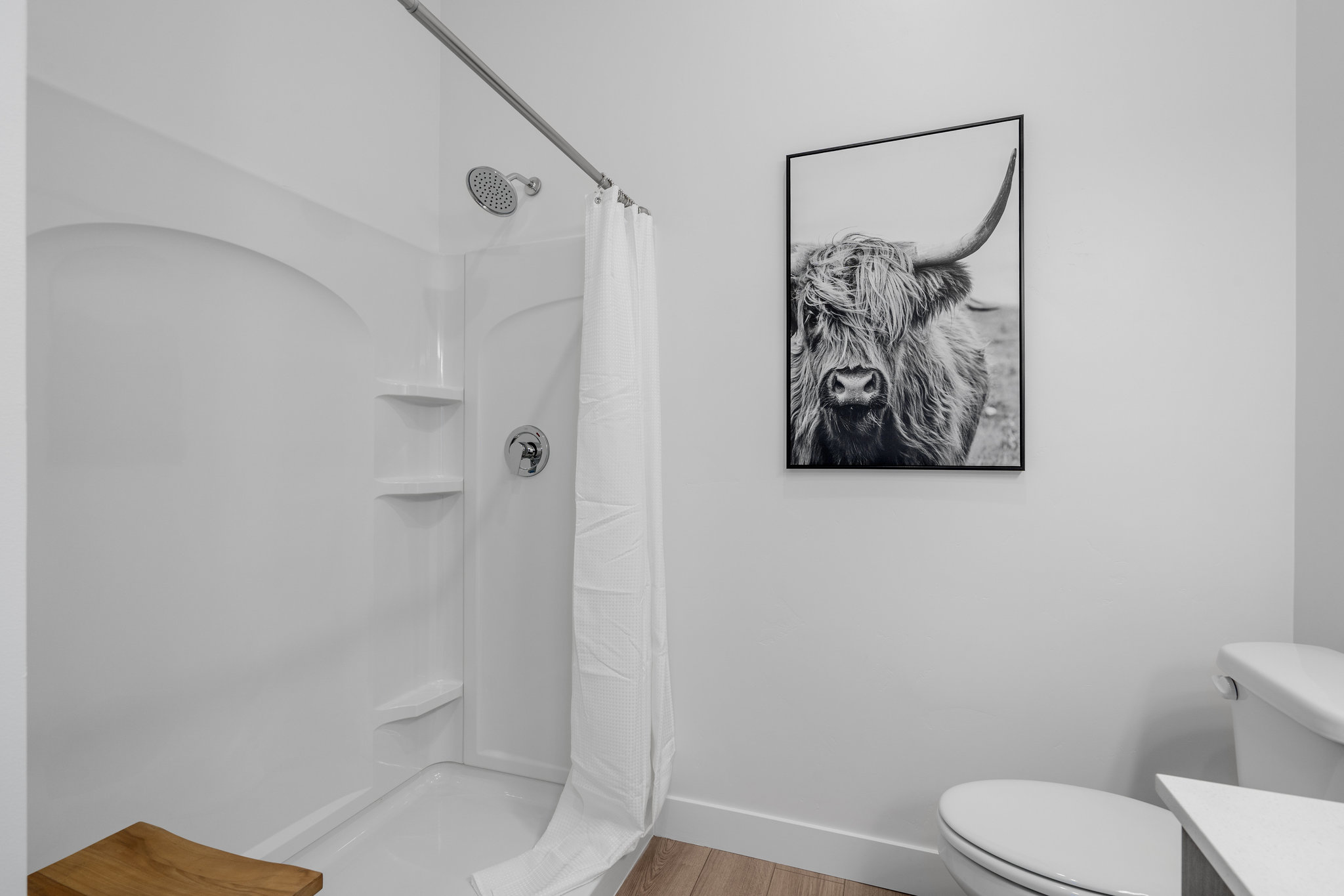 Primary bedroom en' suite with double vanity and walk in shower.