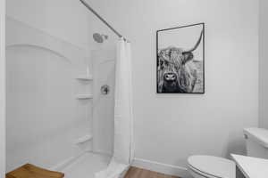 Primary bedroom en' suite with double vanity and walk in shower.