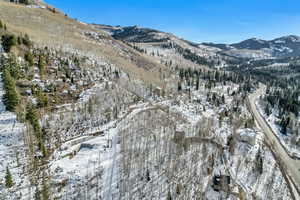 Snowy aerial view featuring a mountain view