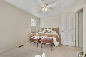 Bedroom with carpet flooring and ceiling fan