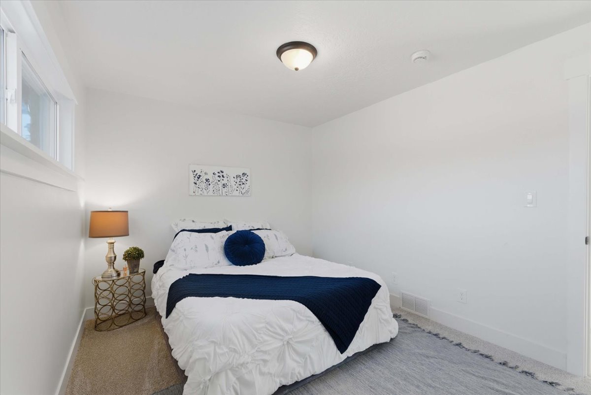 Carpeted bedroom featuring baseboards