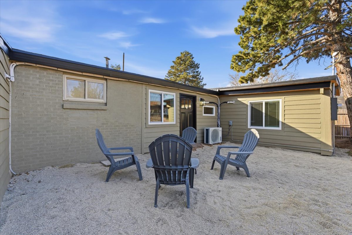 Rear view of property with a patio area and brick siding