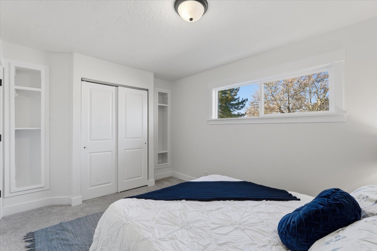 Bedroom with carpet floors and a closet