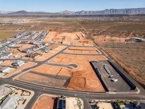 Aerial view of property's location with a mountain backdrop and rural landscape