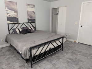 Bedroom with a closet and baseboards