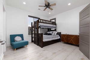 Bedroom with recessed lighting, light wood-style flooring, and a ceiling fan