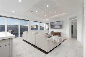 Living area with wood ceiling and recessed lighting