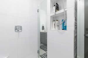 Bathroom featuring a shower stall