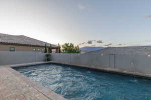 View of swimming pool featuring a fenced backyard