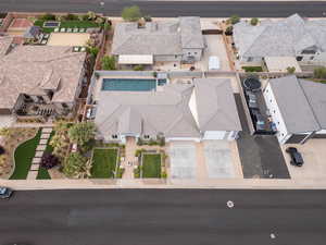 Aerial perspective of suburban area featuring a pool