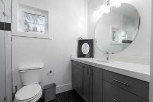 Full bath with vanity, wood finish floors, and a shower with door