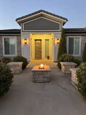 Doorway to property featuring stone siding