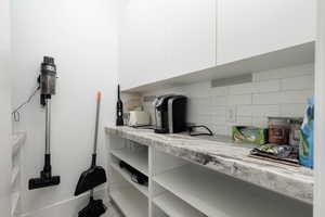 Detailed view of decorative backsplash and a central vacuum unit