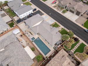 Aerial perspective of suburban area featuring a pool area