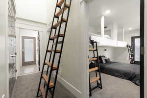 Hall featuring carpet floors and recessed lighting