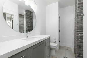 Full bath featuring vanity and a stall shower