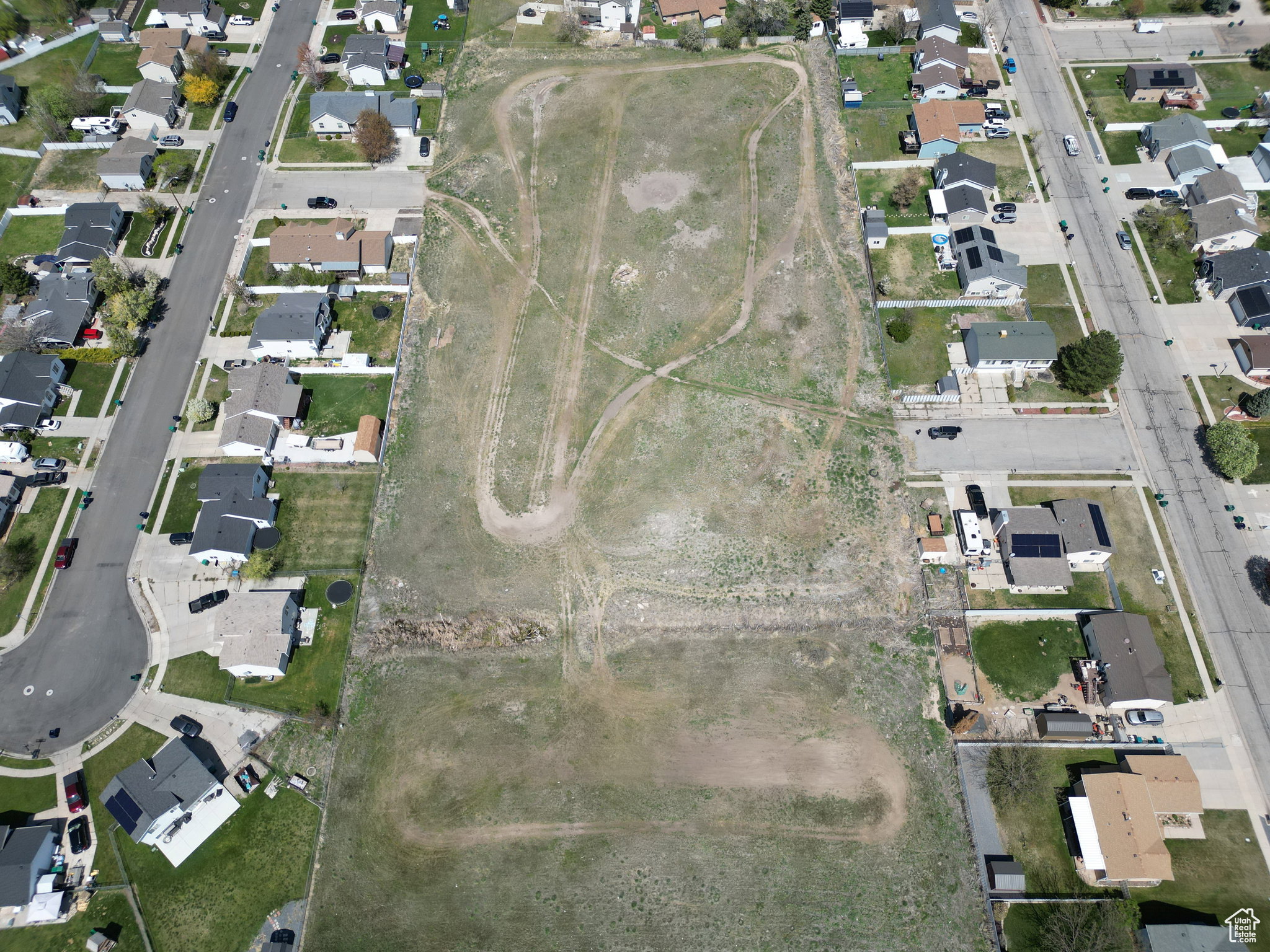 Aerial view of property's location featuring nearby suburban area