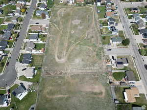 Aerial view of property's location featuring nearby suburban area