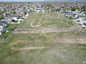 Aerial overview of property's location featuring nearby suburban area