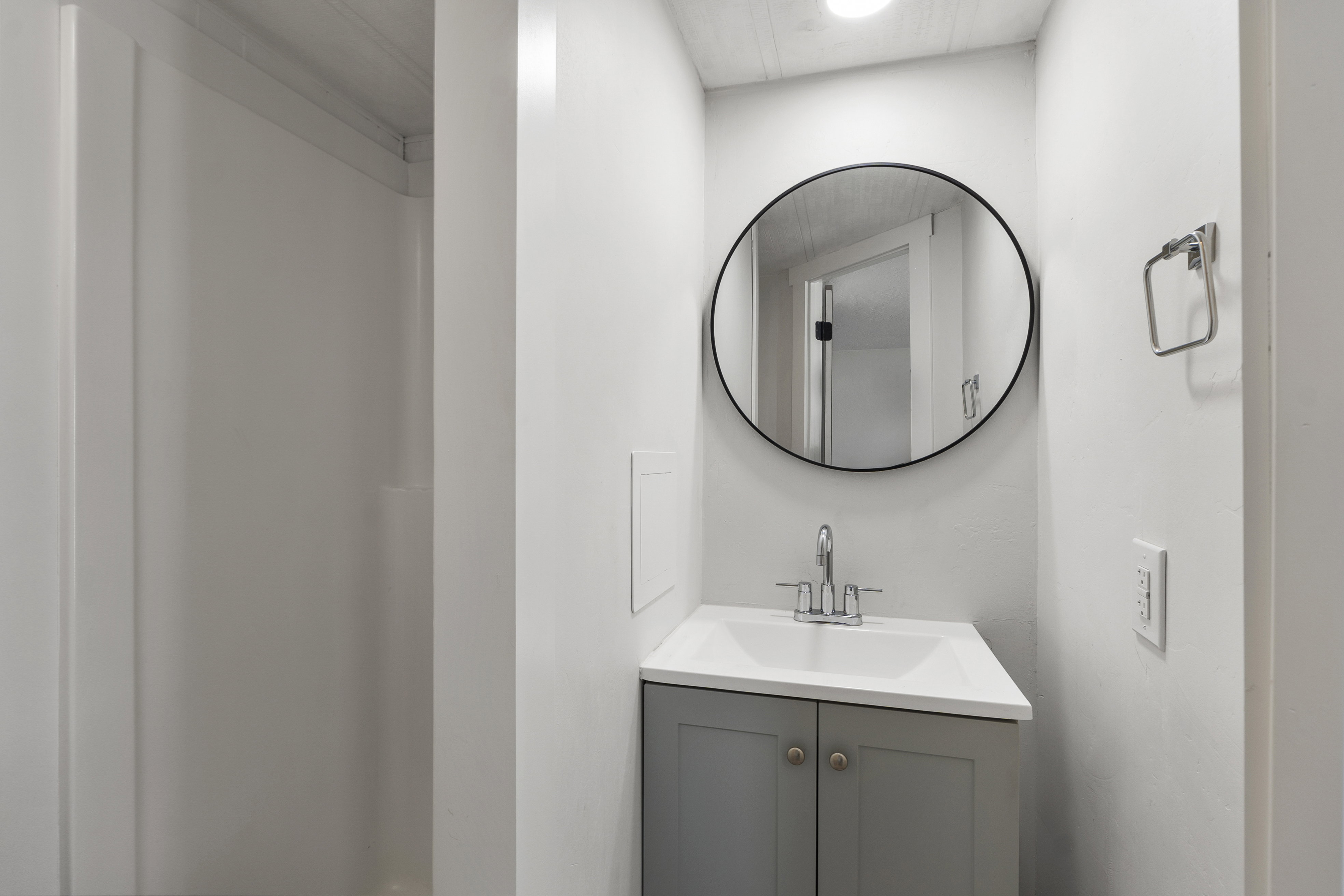 Full bathroom with vanity and a shower