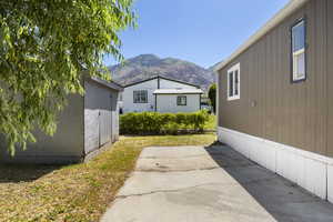 View of side of home featuring a mountain view