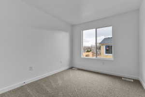 Unfurnished room with baseboards and carpet