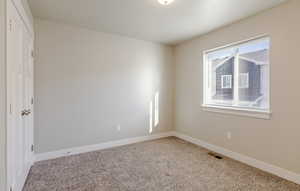 Unfurnished bedroom with carpet floors and a closet