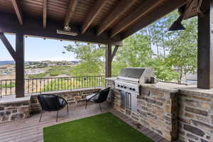 Covered deck with built in gourmet BBQ grill.