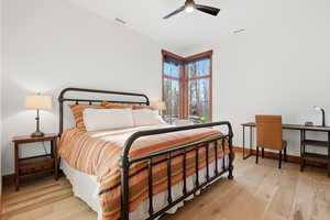 2nd Bedroom with light oak floors, an en suite bathroom and walk-in closet