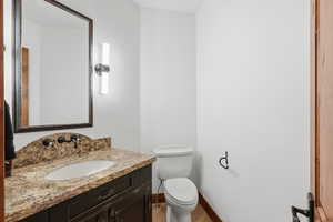 Guest bathroom featuring toilet and vanity