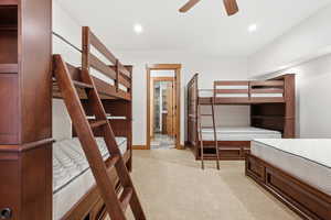 5th bedroom/bunkroom featuring light carpet, ceiling fan, and recessed lighting