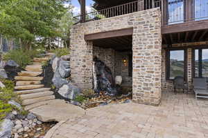 Terrace featuring another waterfall, a stream with a footbridge to the stairs