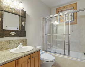 Full bathroom featuring tiled shower / bath combo and vanity