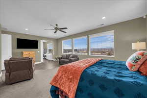 Bedroom with a ceiling fan, recessed lighting, and wood finished floors