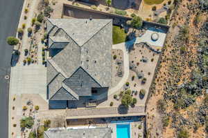 Aerial view of property and surrounding area with a pool