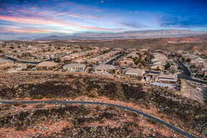Aerial perspective of suburban area with a mountain backdrop