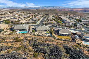 Aerial overview of property's location featuring nearby suburban area and mountains
