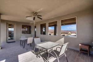 View of patio featuring outdoor dining space and a ceiling fan