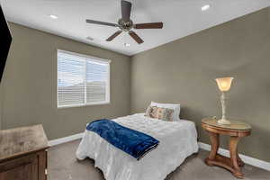 Bedroom featuring carpet, ceiling fan, and recessed lighting