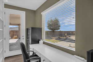 Office with light wood-style flooring