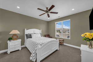 Bedroom featuring carpet, a ceiling fan, and recessed lighting